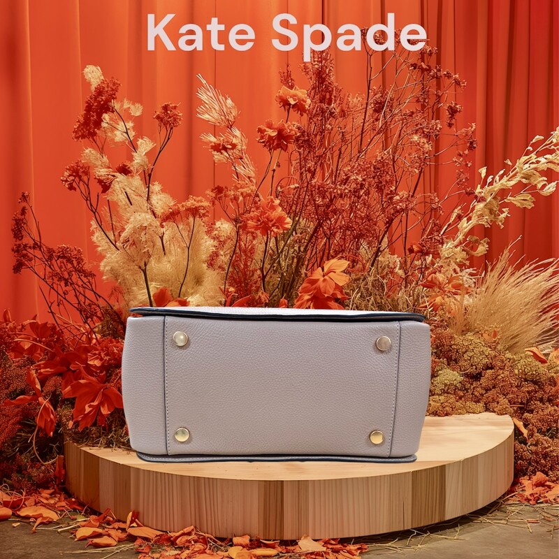 Kate Spade Gramercy Satchel Bag<br />
Designed for a structured silhouette in soft pebbled leather, our Gramercy satchel is perfect for adding a polished touch to your look.<br />
Original MSRP: $448.00<br />
Color: Kraft Paper<br />
7.75\"H x 11.75\"W x 6\"D<br />
Handle drop: 5\"<br />
Strap drop: 22\"<br />
Pebbled leather with smooth leather trim?<br />
Microsuede lining<br />
Plaque logo<br />
Satchel with zip-top closure<br />
Interior slip pocket<br />
Interior zip pocket<br />
Optional (and adjustable) shoulder/crossbody strap<br />
This bag is in like new condition, no marks or flaws