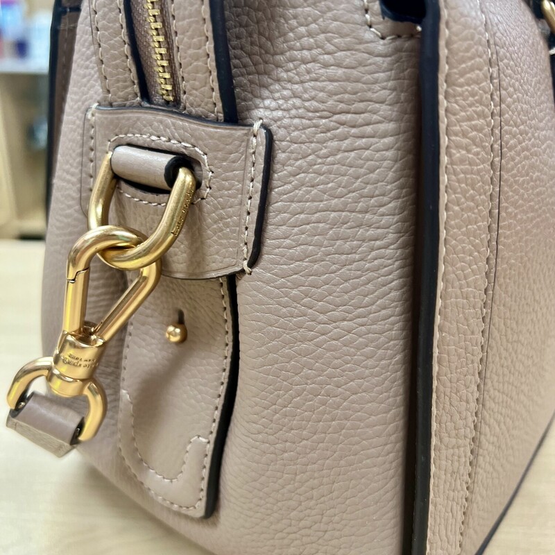 Kate Spade Gramercy Satchel Bag<br />
Designed for a structured silhouette in soft pebbled leather, our Gramercy satchel is perfect for adding a polished touch to your look.<br />
Original MSRP: $448.00<br />
Color: Kraft Paper<br />
7.75\"H x 11.75\"W x 6\"D<br />
Handle drop: 5\"<br />
Strap drop: 22\"<br />
Pebbled leather with smooth leather trim?<br />
Microsuede lining<br />
Plaque logo<br />
Satchel with zip-top closure<br />
Interior slip pocket<br />
Interior zip pocket<br />
Optional (and adjustable) shoulder/crossbody strap<br />
This bag is in like new condition, no marks or flaws