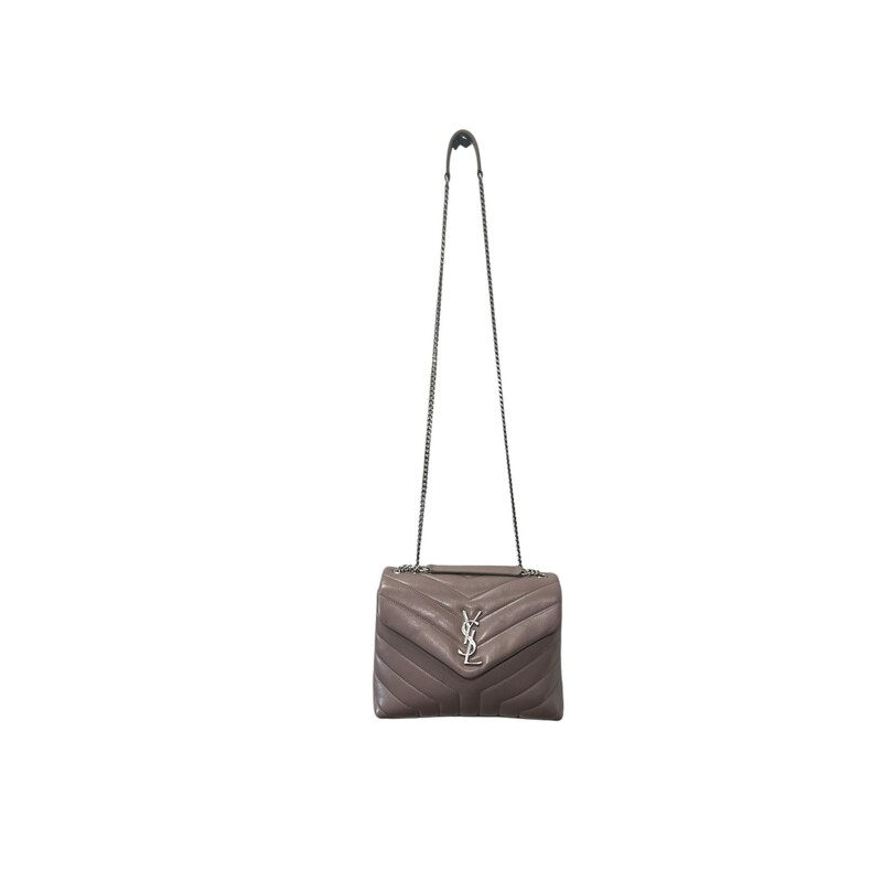 SAINT LAURENT Calfskin Y Quilted Monogram Small Loulou Chain Satchel in Dark Natural. This shoulder tote features chic chevron quilted calfskin leather in brown. The bag has gold chain link shoulder straps with matching leather shoulder pads. The frontal flap features a prominent gold YSL monogram detail and opens to a partitioned black fabric interior with zipper and patch pockets.<br />
Condition: Like New<br />
Dimensions:<br />
Base length: 9.25 in<br />
Height: 7 in<br />
Width: 3.5 in<br />
Drop: 11.5 in<br />
Drop: 22 in<br />
Date Code : LND494699.0518<br />
<br />
Comes with Dust Bag