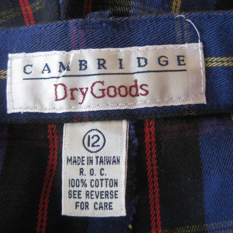 Vtg Cambridge Plaid, Blue, Size: 12<br />
1980s Preppy Plaid trousers in a red, navy, black and yellow by Cambridge Dry Goods.<br />
These are nice medium weight, very soft cotton unlined tapered pants.<br />
They have side pockets, belt loops.  One fake buttoned pocket in the front and one working buttoned pocket at the back.<br />
They're marked size 12, please use the measurments below though, they won't fit a modern size 12 probably<br />
Highwaisted , Tapered legs<br />
These are in great shape, no flaws, but they've been worn and washed a few times<br />
<br />
made in Taiwan<br />
Marked size 12, may fit smaller, please see measurements below:<br />
<br />
flat measurements:<br />
waist: 14.75<br />
hip: 25<br />
rise: 14.25<br />
inseam: 27.5<br />
Side seam: 41<br />
<br />
thanks for looking!<br />
#78027