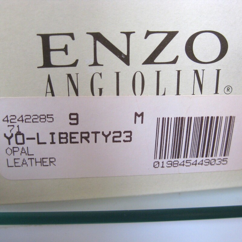 NIB E. Angiolini Loafers, Cream, Size: 9<br />
Here's a never worn pair of vintage loafers by Enzo Angiolini.<br />
They're in tones of cream<br />
size 9.<br />
This model is called the Liberty and the leather is called Opal because it has a bit of a pearlized finish.<br />
They fit true to size, I am a size 9 and they fit well without pinching or slipping off.<br />
<br />
The box is shown for info purposes only, I won't ship the shoes in this box as it would increase shipping cost and the box itself is a little damaged.<br />
<br />
Thank you for looking!<br />
#74983