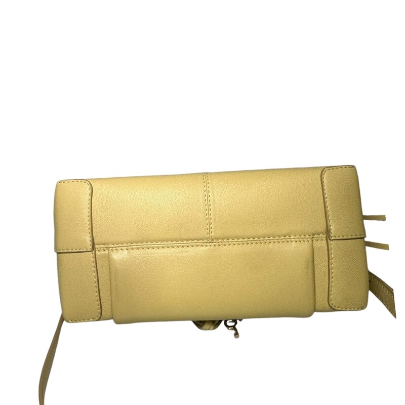 See by Chloé<br />
Yellow Small Joan Crossbody Shoulder Bag<br />
LWG-certified grained leather shoulder bag in yellow.<br />
<br />
· Fixed carry handle<br />
· Detachable and adjustable crossbody strap<br />
· Spring ring with hardware and braided leather trim<br />
· Concealed patch pocket at face<br />
· Text embossed at face<br />
· Zip closure<br />
· Patch pocket at interior<br />
· Cotton twill lining<br />
· H8.25 x W11.5 x D5