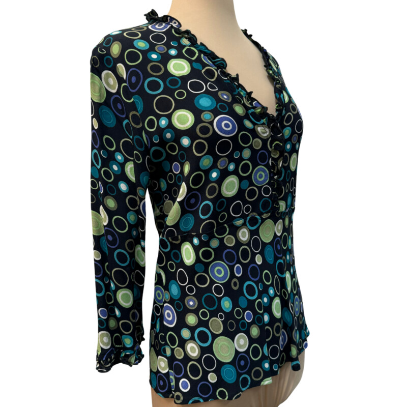 Loco Lindo Ruffled Blouse<br />
100% Rayon<br />
Ruffled neckline and sleeve hem<br />
Colors:Black with Lots of Colorful Dots<br />
Size: Medium