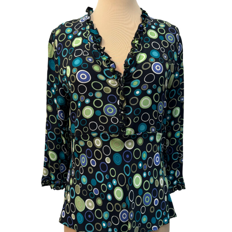 Loco Lindo Ruffled Blouse<br />
100% Rayon<br />
Ruffled neckline and sleeve hem<br />
Colors:Black with Lots of Colorful Dots<br />
Size: Medium