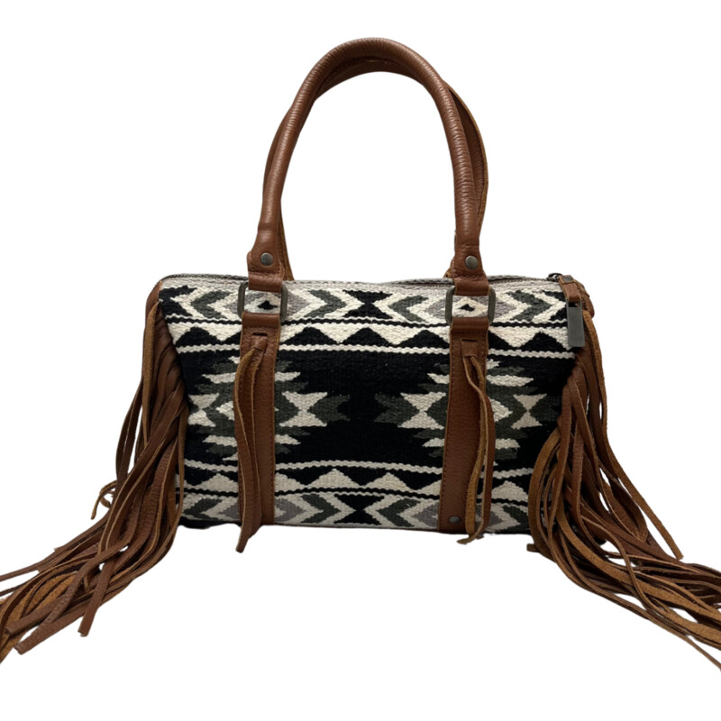 NEW Serape Choula Bag<br />
Genuine leather peiced woven serape purse<br />
The greater the storm, the brighter your rainbow. interior graphic<br />
Zipper closure<br />
Fringe trim and tassle details<br />
Compact/sub-compact interior carry holster<br />
Colors: Black, White, brown<br />
Dimension: 12 1/2 (L) x 5 (W) x 8 1/2 (H)