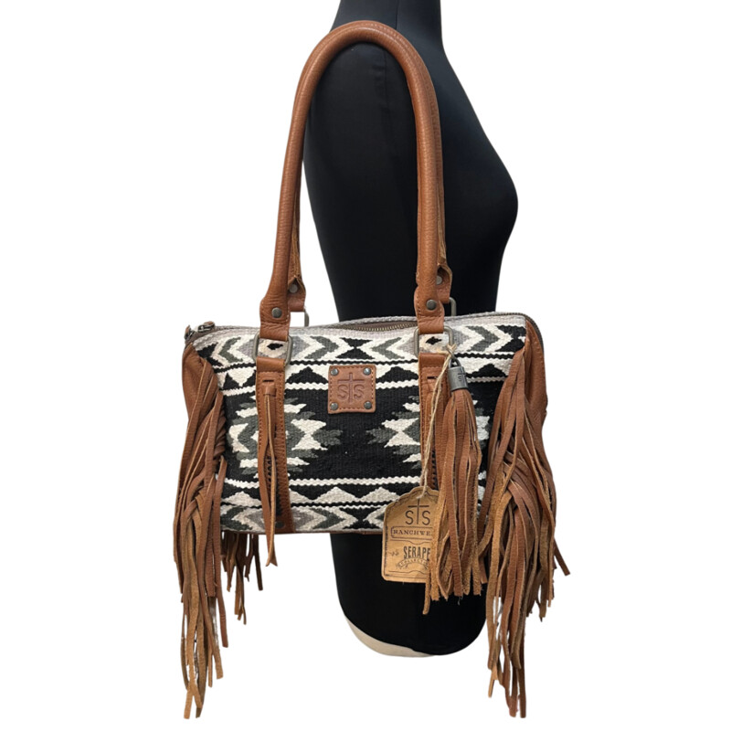 NEW Serape Choula Bag<br />
Genuine leather peiced woven serape purse<br />
The greater the storm, the brighter your rainbow. interior graphic<br />
Zipper closure<br />
Fringe trim and tassle details<br />
Compact/sub-compact interior carry holster<br />
Colors: Black, White, brown<br />
Dimension: 12 1/2 (L) x 5 (W) x 8 1/2 (H)