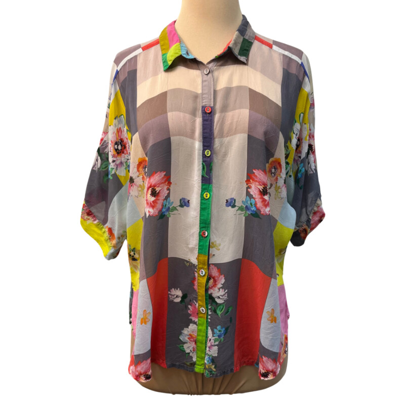 Johnny Was Block Lynn Blouse<br />
Contrasting yet complementary colors and patterns bring the Block Lynn Shirt to life. This shirt is made from a lightweight fabric and boasts a collar, short sleeves, a front button closure, and a bold multicolored block print with a romantic floral overlay.<br />
100% Cupra Rayon<br />
Size: XSmall<br />
<br />
Sold Out on website $198