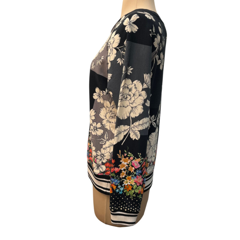 Johnny Was Redland Raglan Crew Sweatshirt<br />
Color: Black with Cream Flowers and Colorful Flowers on the Bottom and Sleeves<br />
96% Cotton 4% Lycra<br />
Size: XSmall<br />
<br />
It is still on the website for $168