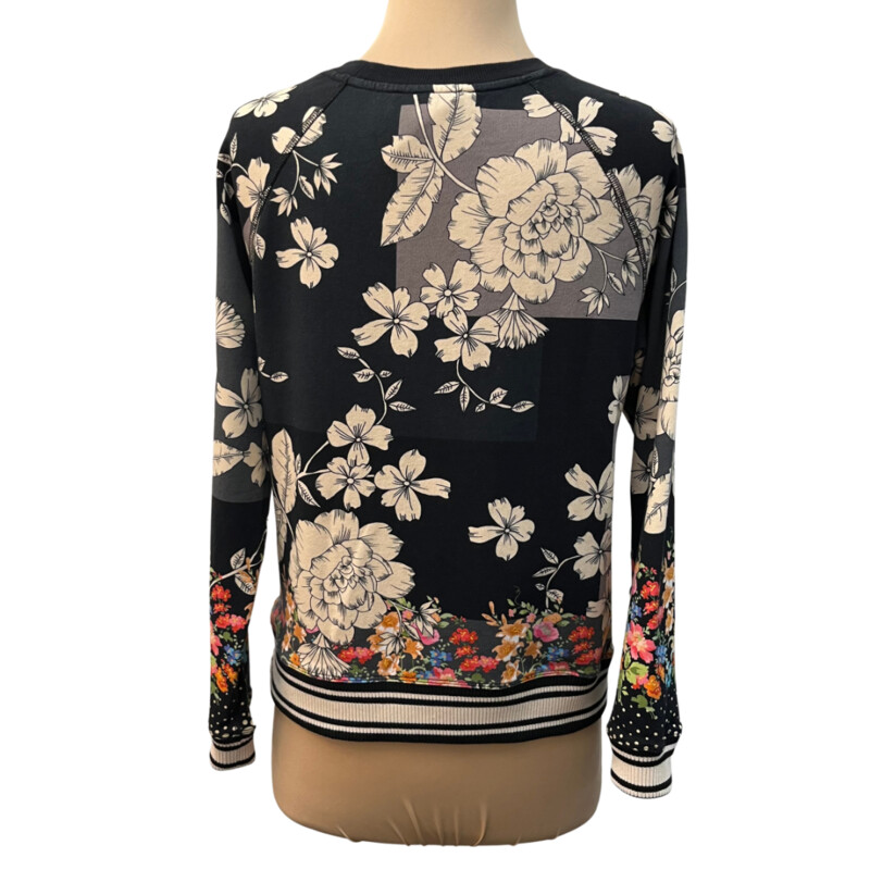 Johnny Was Redland Raglan Crew Sweatshirt<br />
Color: Black with Cream Flowers and Colorful Flowers on the Bottom and Sleeves<br />
96% Cotton 4% Lycra<br />
Size: XSmall<br />
<br />
It is still on the website for $168