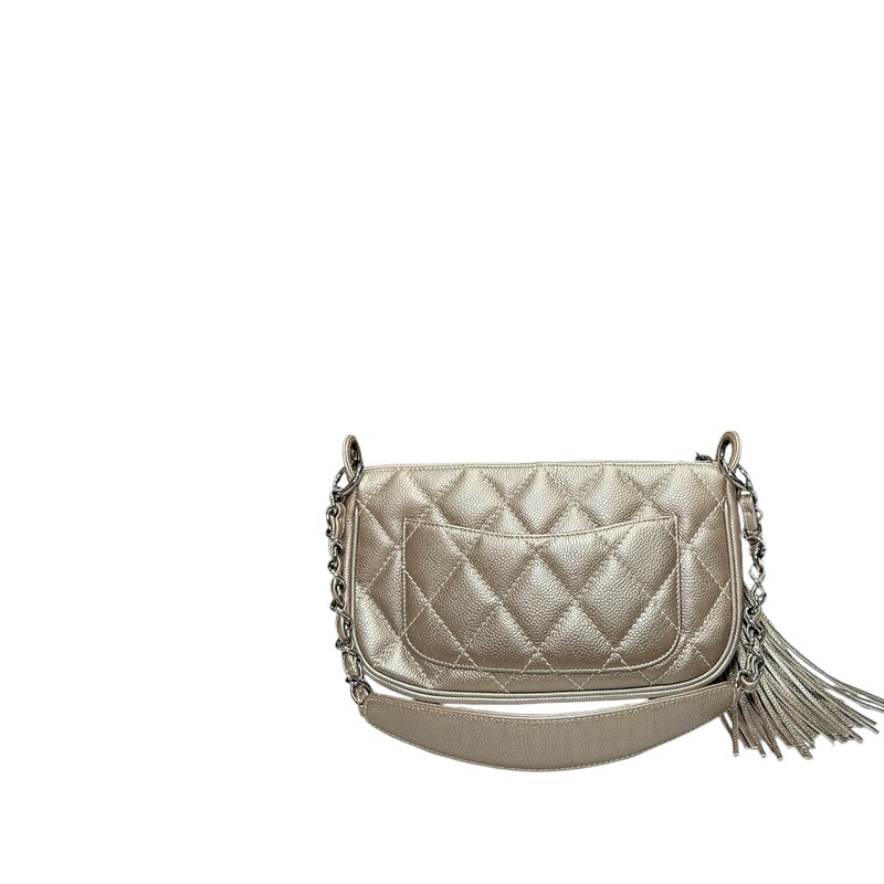 Chanel Shoulder Bag<br />
From the 2004-2005 Collection by Karl Lagerfeld<br />
Interlocking CC Logo, Quilted Pattern & Chain-Link Accent<br />
Silver-Tone Hardware<br />
Chain-Link Shoulder Strap<br />
Tassel & Chain-Link Accents<br />
Single Exterior Pocket<br />
Logo Jacquard Lining & Single Interior Pocket<br />
Zip Closure at Top<br />
<br />
Date Code:9662046<br />
<br />
Dimensions:<br />
Base length: 10.75 in<br />
Height: 7 in<br />
Width: 3.5 in<br />
Drop: 11.5 in