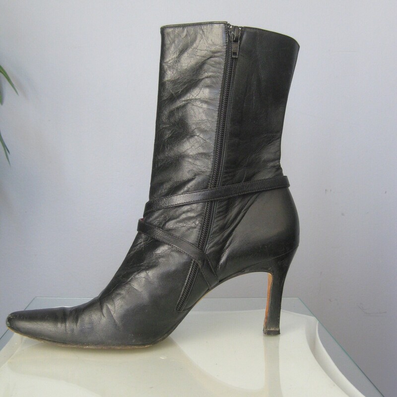 Beverly Leather Half, Black, Size: 9<br />
This is a pair of wickedly glamourous high heeled leather boots in black leather with red leather lining.  They're by Beverly Feldman.  Very high quality.<br />
They have side zippers and a leather strap decorated with a rhinestone buckle.<br />
marked size 9, which is my size and they fit me well.<br />
The heel is 3.5<br />
<br />
The boots are used. They  are in good to very good used condition, here are the things I've noticed:<br />
The pointy toes have some damage<br />
There is a marked at the top of the shaft of one boot.<br />
One of the rhinestone buckles is missing a stone<br />
The heels have some wear and possibly water damage.<br />
Please see all of my photos before purchasing.<br />
Happy to quickly respond to any questions.<br />
Priced accordingly<br />
<br />
Thanks for looking!<br />
#79150