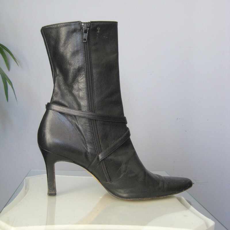 Beverly Leather Half, Black, Size: 9<br />
This is a pair of wickedly glamourous high heeled leather boots in black leather with red leather lining.  They're by Beverly Feldman.  Very high quality.<br />
They have side zippers and a leather strap decorated with a rhinestone buckle.<br />
marked size 9, which is my size and they fit me well.<br />
The heel is 3.5<br />
<br />
The boots are used. They  are in good to very good used condition, here are the things I've noticed:<br />
The pointy toes have some damage<br />
There is a marked at the top of the shaft of one boot.<br />
One of the rhinestone buckles is missing a stone<br />
The heels have some wear and possibly water damage.<br />
Please see all of my photos before purchasing.<br />
Happy to quickly respond to any questions.<br />
Priced accordingly<br />
<br />
Thanks for looking!<br />
#79150