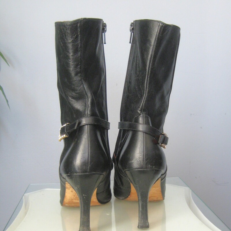 Beverly Leather Half, Black, Size: 9<br />
This is a pair of wickedly glamourous high heeled leather boots in black leather with red leather lining.  They're by Beverly Feldman.  Very high quality.<br />
They have side zippers and a leather strap decorated with a rhinestone buckle.<br />
marked size 9, which is my size and they fit me well.<br />
The heel is 3.5<br />
<br />
The boots are used. They  are in good to very good used condition, here are the things I've noticed:<br />
The pointy toes have some damage<br />
There is a marked at the top of the shaft of one boot.<br />
One of the rhinestone buckles is missing a stone<br />
The heels have some wear and possibly water damage.<br />
Please see all of my photos before purchasing.<br />
Happy to quickly respond to any questions.<br />
Priced accordingly<br />
<br />
Thanks for looking!<br />
#79150