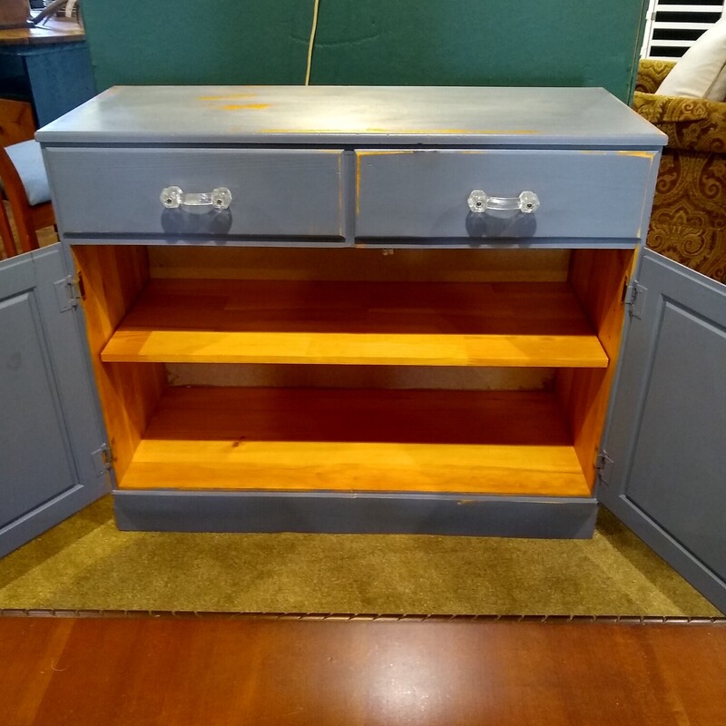 Blue Distressed Cabinet,<br />
<br />
Blue cabinet with a distressed finish.  Cabinet has 2 doors below with a shelf inside and 2 drawers.<br />
<br />
Size: 36 in wide X 15 in deep X 30 in high