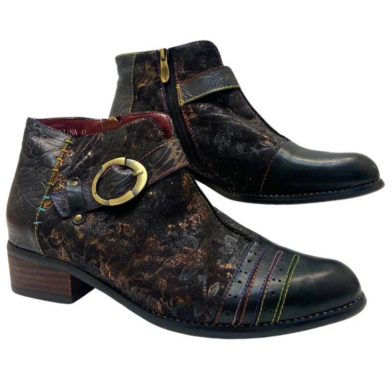 L Artiste by Spring Step Georgiana Bootie<br />
A bold buckle accent, black leather,  rainbow stitching, and metallic floral construction sets these ankle boots apart from the rest!<br />
<br />
FEATURES<br />
Leather upper<br />
Inside zip closure<br />
Round cap toe<br />
Fabric lining<br />
Cushioned footbed<br />
1½ stacked block heel<br />
Rubber sole<br />
Imported Size: 10