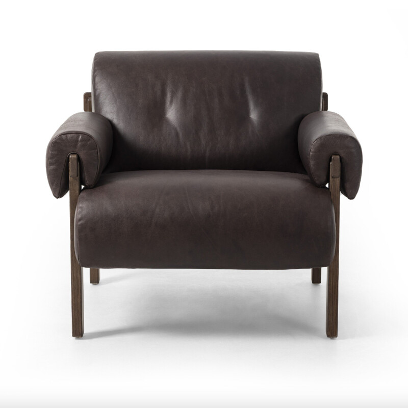 Four Hands Cora Chair in Conroe Cigar Leather<br />
<br />
<br />
Size: 34.5Wx35.5x30.5T<br />
<br />
This found fireside chair is the embodiment of comfort with its S-spring seating construction, plush seat and back, and feather fiber-filled arm cushions. Blind tufts on the arms and back lend a subtle detail that elevates the overall style.