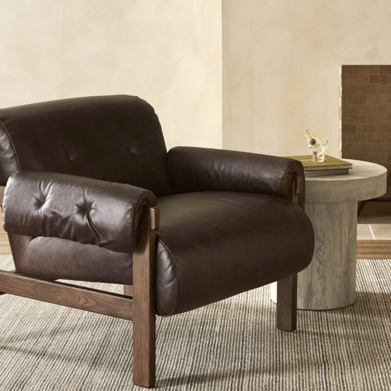 Four Hands Cora Chair in Conroe Cigar Leather<br />
<br />
<br />
Size: 34.5Wx35.5x30.5T<br />
<br />
This found fireside chair is the embodiment of comfort with its S-spring seating construction, plush seat and back, and feather fiber-filled arm cushions. Blind tufts on the arms and back lend a subtle detail that elevates the overall style.