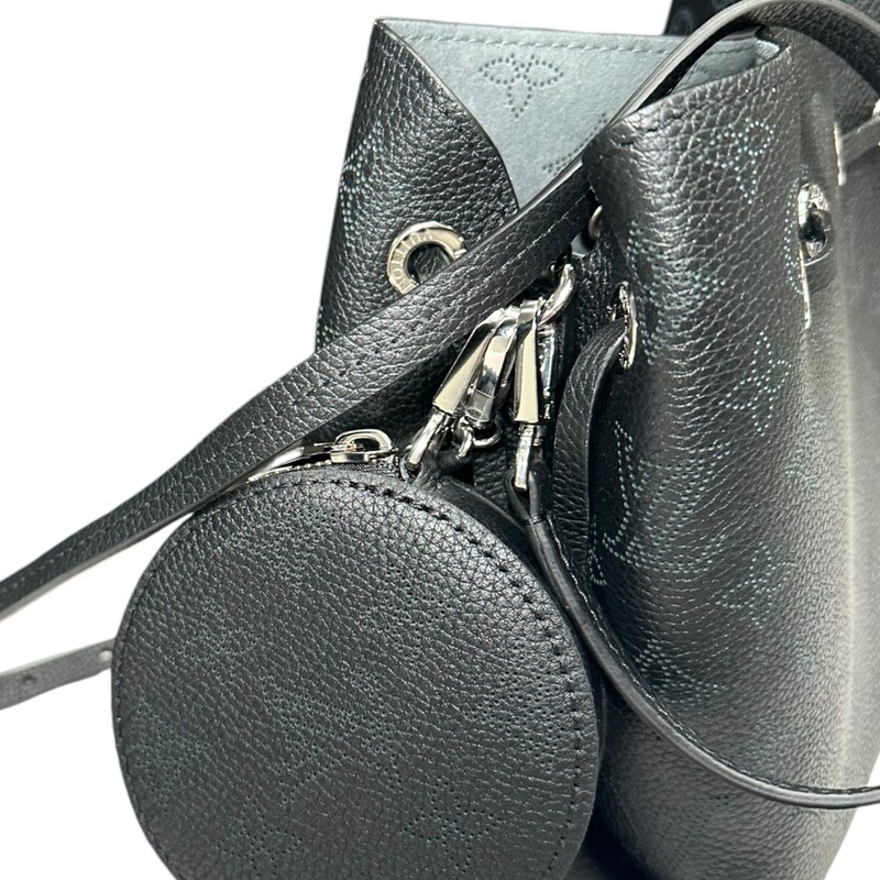 Louis Vuitton  Bella bucket bag in Mahina calf leather with its perforated Monogram pattern. The bag’s small size and the attached round coin purse, featuring a miniature version of the perforated Monogram motif on one side, make it modern, desirable and trendy. The sophisticated leather and metal mixed handle associated with a removable leather strap bring versatility.<br />
Dimensions:<br />
7.5 x 8.7 x 5.5 inches<br />
Date Code: Microchip comes with entrupy<br />
(Length x Height x Width)<br />
<br />
Mahina perforated calf leather<br />
Calf-leather trim<br />
Microfiber lining<br />
Silver-color hardware<br />
Round coin purse<br />
Leather drawstring to secure belongings<br />
4 protective metal bottom studs<br />
Strap:Removable, adjustable<br />
Strap drop:19.7 inches<br />
Strap drop max:22.0 inches<br />
Handle:Single, removable