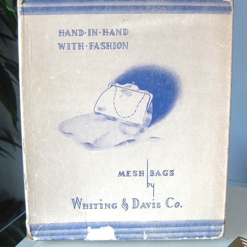 This gold mesh bag from Whiting and Davis is a classic and this one has never been used.<br />
It comes with its orginal gift box, the box is in ok shape, not perfect as you can see from my photos.<br />
<br />
It's got a matte gold metal frame with chain strap and brand markings<br />
The body of the bag is made of their patented gold mesh.<br />
Interior lined with satin<br />
5 wide<br />
7.5<br />
Thanks for looking!<br />
#72241