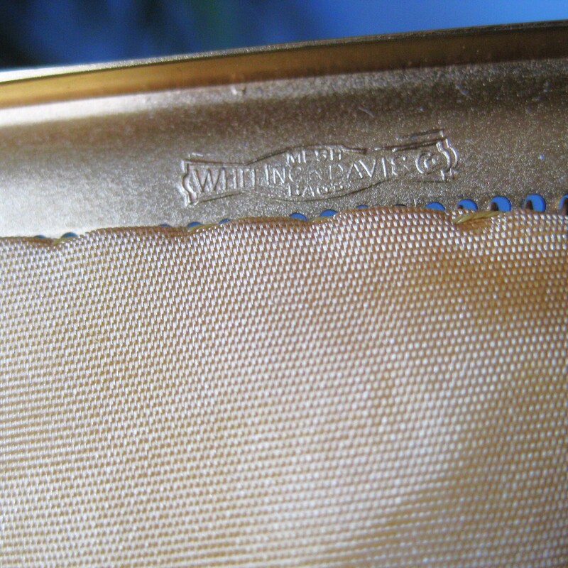 This gold mesh bag from Whiting and Davis is a classic and this one has never been used.<br />
It comes with its orginal gift box, the box is in ok shape, not perfect as you can see from my photos.<br />
<br />
It's got a matte gold metal frame with chain strap and brand markings<br />
The body of the bag is made of their patented gold mesh.<br />
Interior lined with satin<br />
5 wide<br />
7.5<br />
Thanks for looking!<br />
#72241