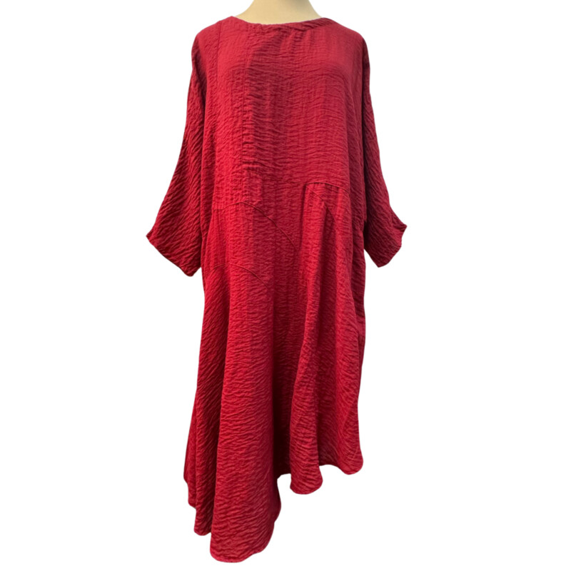 Eleven Stitch Crinkle Texture Dress<br />
3/4 sleeves<br />
Has pockets!<br />
Asymmetrical hem<br />
74% Rayon/26% Nylon<br />
Color: Garnet<br />
Size: Medium