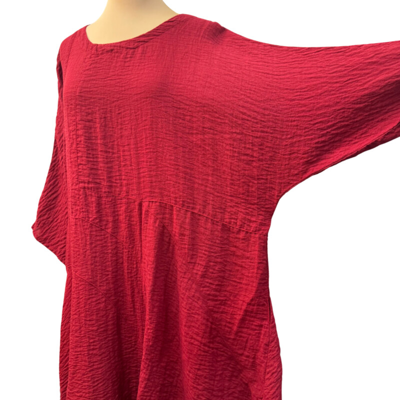 Eleven Stitch Crinkle Texture Dress<br />
3/4 sleeves<br />
Has pockets!<br />
Asymmetrical hem<br />
74% Rayon/26% Nylon<br />
Color: Garnet<br />
Size: Medium