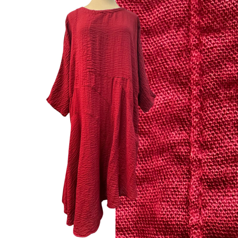 Eleven Stitch Crinkle Texture Dress
3/4 sleeves
Has pockets!
Asymmetrical hem
74% Rayon/26% Nylon
Color: Garnet
Size: Medium