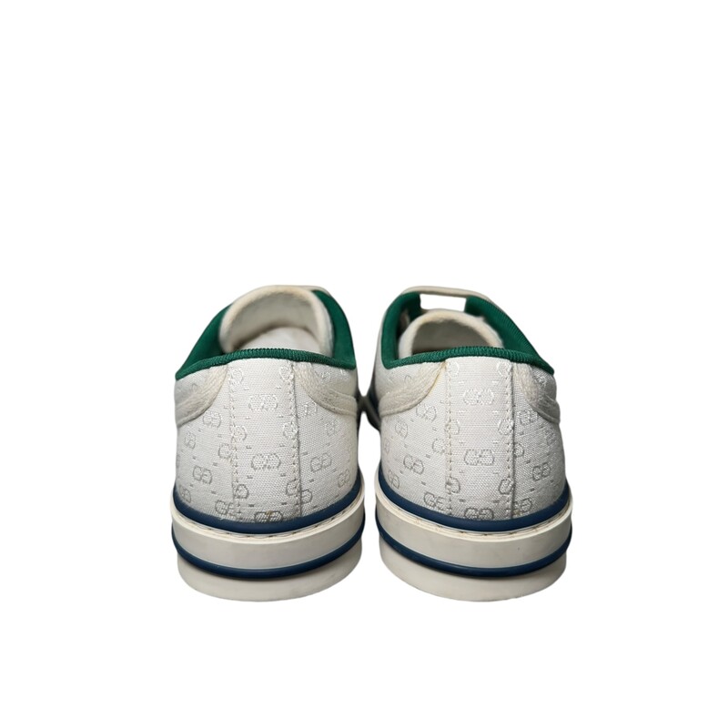 Gucci Tennis 1977 label<br />
This pair of Gucci Tennis 1977 is defined by the iconic green and red Web.<br />
White Canvas<br />
GG motif at the sole<br />
Rubber sole<br />
Lace-up closure<br />
Made in Italy<br />
<br />
Comes with dust bags and box