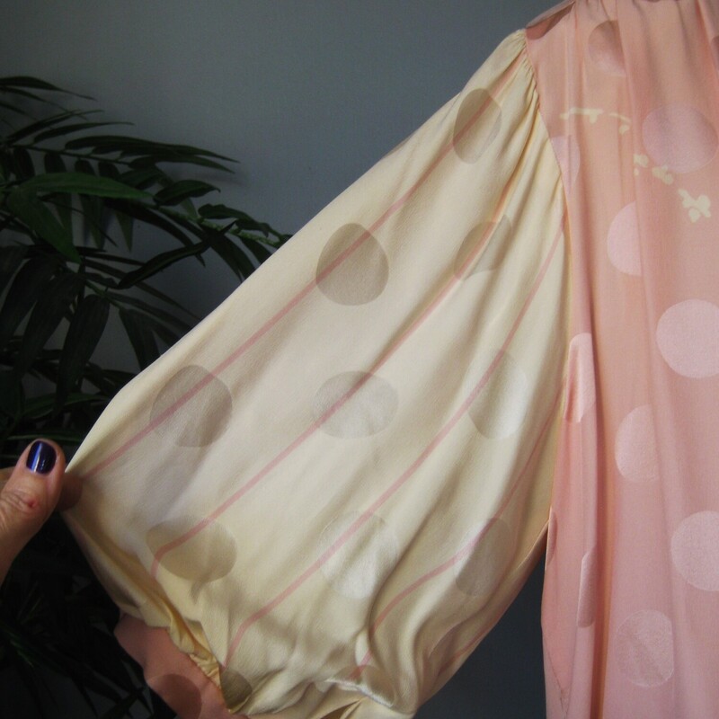 Vtg St Rome Silk Drop Wst, Pink, Size: 12<br />
Pastel pink and yellow evening dress from the 1980s by Saint Romei<br />
The dress was made in the 1980s in Korea.<br />
The silk has a slightly gauzy feel and it's jacquard with big circles woven into the fabric and a complicated but subtle floral print.<br />
It has big shoulders (with pads) and is slim through the hips.<br />
The silhouette is reinforced with low set ties.<br />
Silk covered buttons at the back and the cuffs<br />
(one of the cuff buttons is a plain plastic replacement)<br />
The sleeves will come to about the elbow.<br />
CONDITION: I found one faint stain on the front.  I did not try to do anything to it for fear of making it worse and I feel it's not really noticeable unless upon close inspection.<br />
Makred size 12<br />
Here are the flat measurements, please double where appropriate:<br />
Shoulder to shoulder: 16<br />
Armpit to Armpit: 24.5<br />
Waist: free<br />
Hips: 18.5<br />
Length from back of neck to hem: 42.5<br />
<br />
Thank you for looking.<br />
#76774