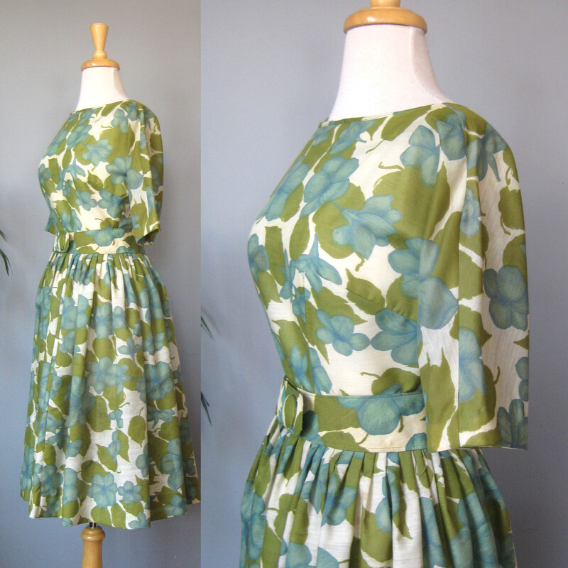 Vtg Carol Craig Sheer, Green, Size: Small
Here's a darling summer dress in a large scale floral print in muted teal blue and olive green.  It's by Carol Craig.
The fabric is a lightweight woven with a good amount of body.
I don't have anything under it to poof it out in my pictures and you can see that the skirt, full and gathered has a nice full bell shape.
the dress is unlined.
It has a matching belt with a big decorative button and snap closures.
Center back metal zipper
Elbow length sleeves
No size or fabric tags
No flaws
It fits my modern size 4 mannequin perfectly
Here are the flat measurements, please double where appropriate:
Armpit to Armpit: 17
Waist: 14
Hip: free
Length: 40

Thank you for looking.
#73068