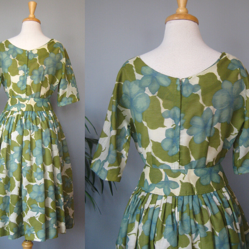 Vtg Carol Craig Sheer, Green, Size: Small<br />
Here's a darling summer dress in a large scale floral print in muted teal blue and olive green.  It's by Carol Craig.<br />
The fabric is a lightweight woven with a good amount of body.<br />
I don't have anything under it to poof it out in my pictures and you can see that the skirt, full and gathered has a nice full bell shape.<br />
the dress is unlined.<br />
It has a matching belt with a big decorative button and snap closures.<br />
Center back metal zipper<br />
Elbow length sleeves<br />
No size or fabric tags<br />
No flaws<br />
It fits my modern size 4 mannequin perfectly<br />
Here are the flat measurements, please double where appropriate:<br />
Armpit to Armpit: 17<br />
Waist: 14<br />
Hip: free<br />
Length: 40<br />
<br />
Thank you for looking.<br />
#73068