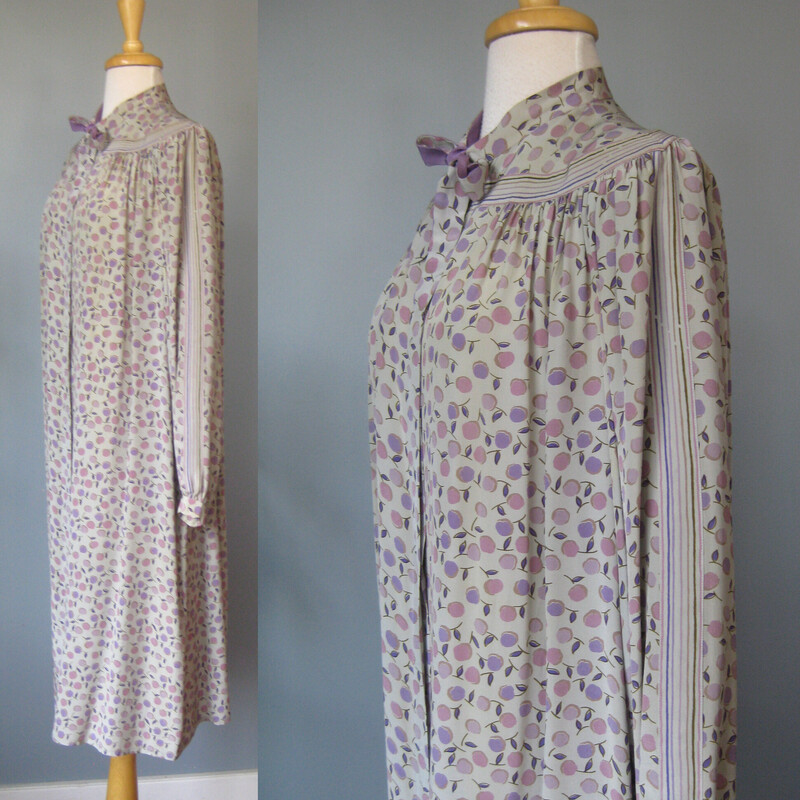 Francesca Damon Silk, Gray, Size: 10<br />
Here is a pretty silk dress is soft grays and lavender with a subtle floral print.<br />
It's from the 1980s.<br />
by Francesca Damon for Starington and it was purchased at Neiman Marcus.<br />
Made in Hong Kong<br />
The dress has hidden buttons all the way down the front.<br />
It has a high collar with attached sash ties.<br />
It comes with a matching sash, wider than the neck ties but not long enough to serve as a belt.<br />
Unlined<br />
Pockets<br />
Long sleeves with button cuffs<br />
small shoulder pads.<br />
it's marked size 10 but use these measurements to be sure it will fit. It seems like it will fit larger than a modern size 10.<br />
Flat measurements:<br />
Shoulder to shoulder: 14.5<br />
armpit to armpit: 23.5<br />
Waist: 24<br />
Hip: up to 25<br />
Length: 44<br />
Underarm sleeve seam: 19 (sleeve buttons at the end)<br />
<br />
perfect condition!<br />
<br />
Thanks for looking!<br />
#72244