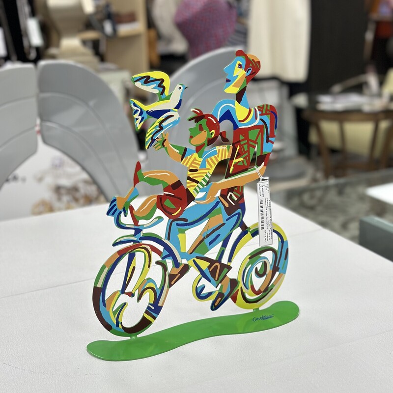 Weekend Ride Sculpture, Handpainted on metal, Multicolored.
Size: 14x12 In