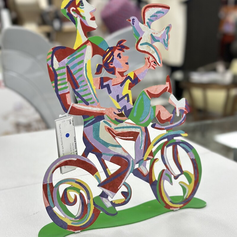 Weekend Ride Sculpture, Handpainted on metal, Multicolored.<br />
Size: 14x12 In