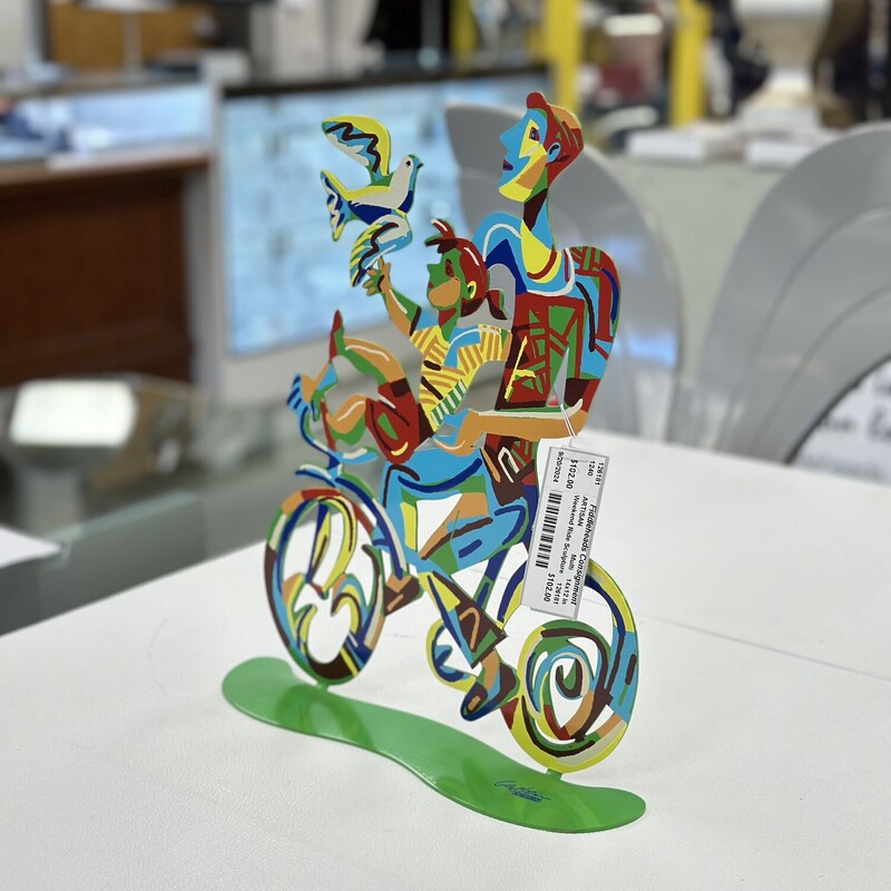 Weekend Ride Sculpture, Handpainted on metal, Multicolored.<br />
Size: 14x12 In