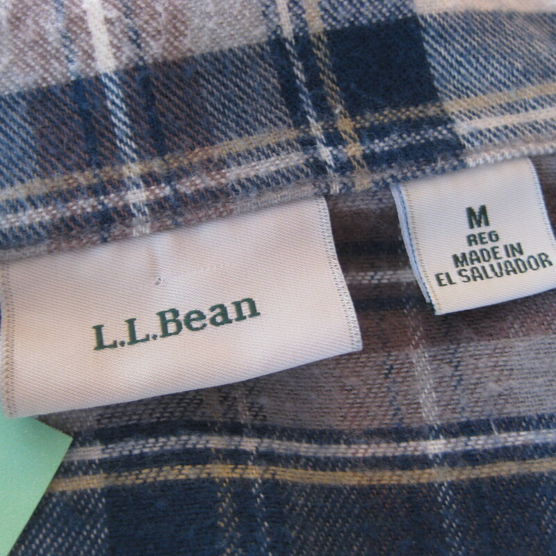 Cozy Winter Sunday mornings would not be complete without a nice pair of flannel PJs no?<br />
These are LL Bean 100% cotton plaid ones in grays and blue.<br />
The top is a collared button down with one chest pocket<br />
The pants are elastic waist with a drawstring and pockets.<br />
Made in El Salvador<br />
Pre-owned, washed a few times but pristine.<br />
Size M<br />
Flat measurements:<br />
Pants:<br />
Waist: 13.5 unstretched, stretches comfortable to 16.5<br />
Hip: 26<br />
Rise: 13<br />
inseam: 28.5<br />
Top:<br />
shoulder to shoulder: 15.5<br />
armpit to armpit: 21<br />
length: 27.25<br />
underarm sleeve seam: 19.5<br />
<br />
Thanks for looking!<br />
#78516