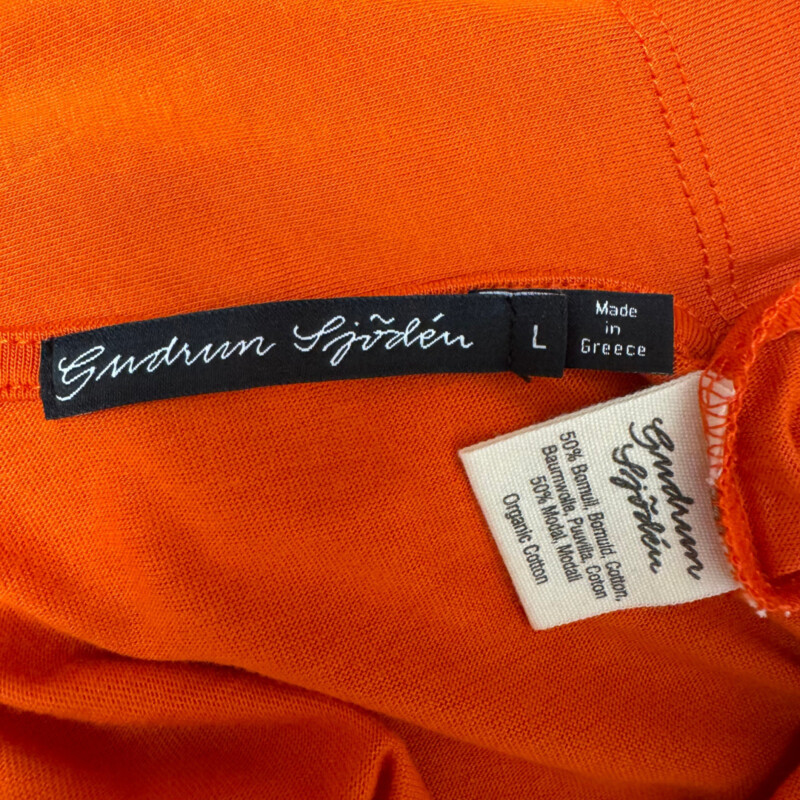 Gudrun Sjödén Dress<br />
Organic Cotton and Modal<br />
Drawstring Waist with Pockets<br />
3/4 Sleeves<br />
Color:  Orange<br />
Size: Large