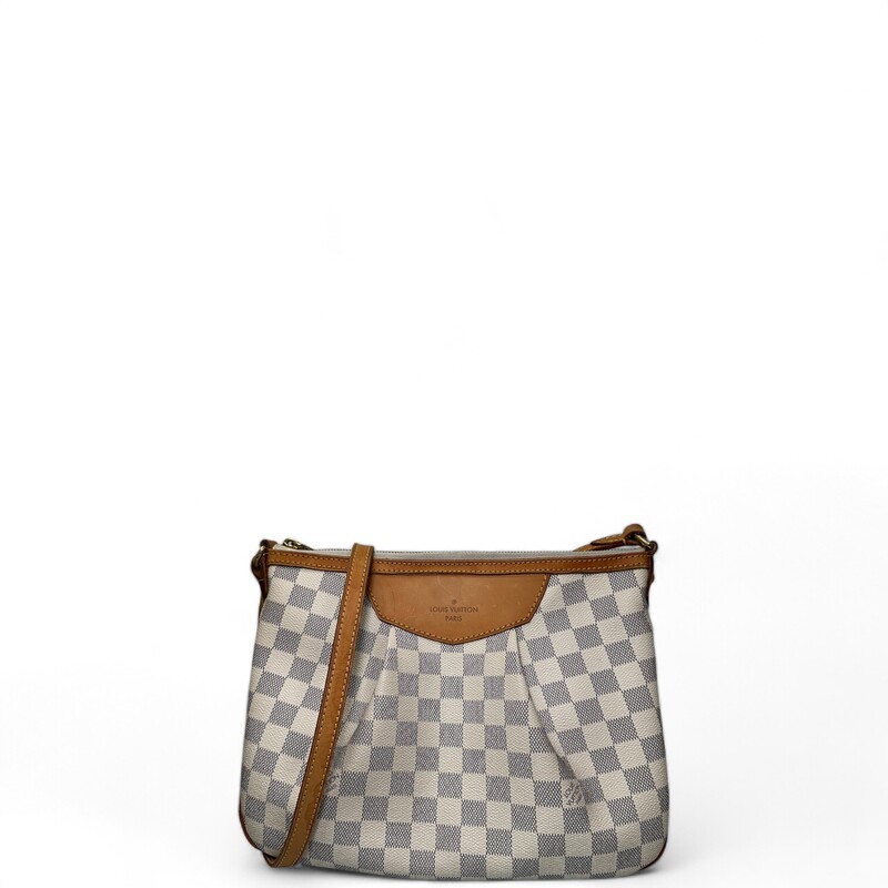 Louis Vuitton Siracusa, Azur, Size: PM
LOUIS VUITTON Damier Azur Siracusa PM. This stylish shoulder bag is crafted of Louis Vuitton damier azur blue and white checkered canvas with a distinctive pleated structure design. It features an adjustable signature vachetta cowhide leather shoulder strap and polished brass hardware and buckle. The polished brass top zipper opens to a beige fabric interior with pockets.
Dimensions:
 Length: 12 in
Height: 8.5 in
Width: 4 in
Drop: 18 in

Date Code: MI4190
*Some water marks on leather