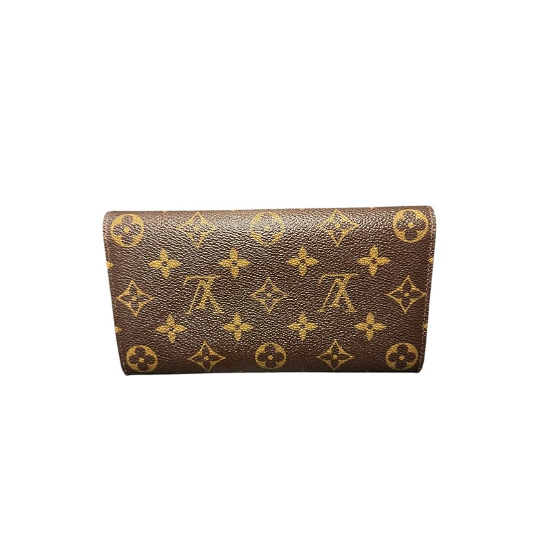 Louis Vuitton Sarah Wallet<br />
This classic wallet is crafted of traditional monogram toile coated canvas. The facing flap has a polished brass snap that opens to a partitioned grain leather interior with a middle zipper compartment.<br />
Dimensions:<br />
Length: 7.5 in<br />
Height: 4 in<br />
Width: 1 in<br />
<br />
Date Code: MI0095