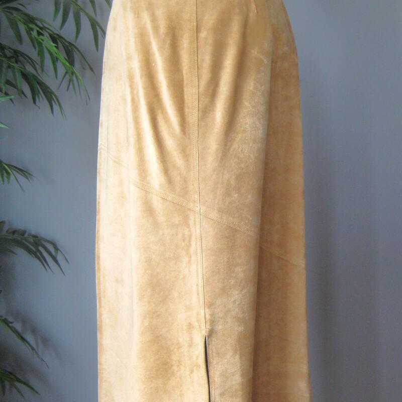 Here is a great separate for your vintage wardrobe.  It's a warm beige midi skirt in suede by Margaret Godfrey.<br />
simple with a front fly (zipper and slide hook and eye) and button loops at the top.<br />
Fully lined<br />
Heavy!<br />
A super versatile piece in super shape.<br />
Here are the flat measurements, please double where appropriate:<br />
Marked size 6 but best for a size 4 imo<br />
Waist: 15.25<br />
Hips: 20.5<br />
Length: 37.25<br />
<br />
Thank you for looking.<br />
#79838