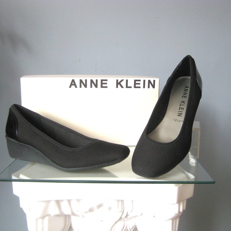 Smart looking and comfortable black wedges from Anne Klein with Ifex technology.
This pair is brand new size 9
Squared off toe, water resistant material with practical patent cladding at the back.

The box is shown in my photos for information purposed ONLY.
I will not ship these in the box.
If you wish me to send them in the box, pls communicate with me before purchasing as the shipping cost will have to be adjusted.

Thanks for looking!
#76588