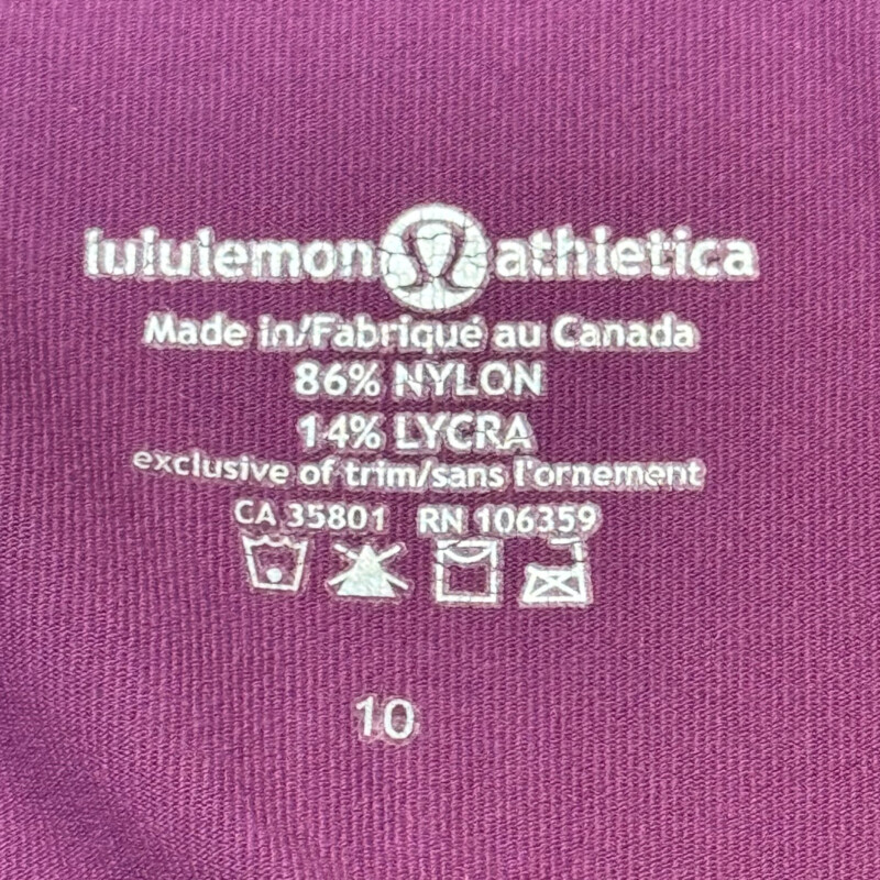 Lululemon Zip Jacket<br />
Colorblock Design<br />
Zipper Pocket on Sleeve<br />
Lavender and Lilac<br />
Size: Medium