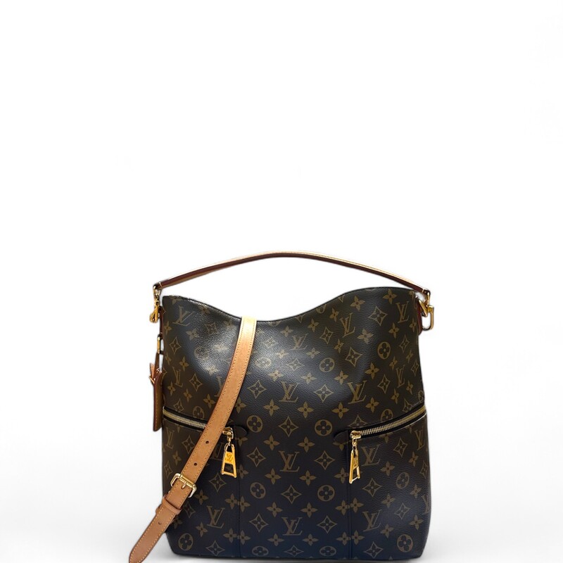 LOUIS VUITTON Monogram Melie. This chic hobo bag is finely crafted of classic Louis Vuitton monogram coated canvas in brown. The bag features zipper pockets on either side, a vachetta leather top handle, and a removable, adjustable vachetta leather shoulder strap with polished gold hardware. The top is open to a deep purple microfiber interior with patch pockets.
Dimensions:
Base length: 12 in
Height: 13.75 in
Width: 4.5 in
Drop: 3.5 in
Drop: 14 in
Date Code: SA0188

Some water marks on tag shown in photo.