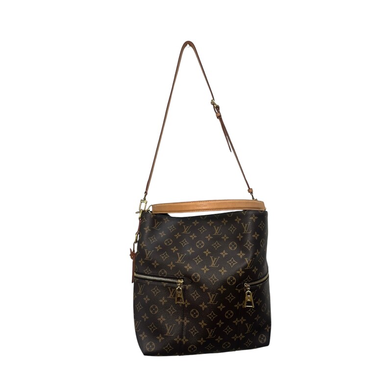 LOUIS VUITTON Monogram Melie. This chic hobo bag is finely crafted of classic Louis Vuitton monogram coated canvas in brown. The bag features zipper pockets on either side, a vachetta leather top handle, and a removable, adjustable vachetta leather shoulder strap with polished gold hardware. The top is open to a deep purple microfiber interior with patch pockets.<br />
Dimensions:<br />
Base length: 12 in<br />
Height: 13.75 in<br />
Width: 4.5 in<br />
Drop: 3.5 in<br />
Drop: 14 in<br />
Date Code: SA0188<br />
<br />
Some water marks on tag shown in photo.