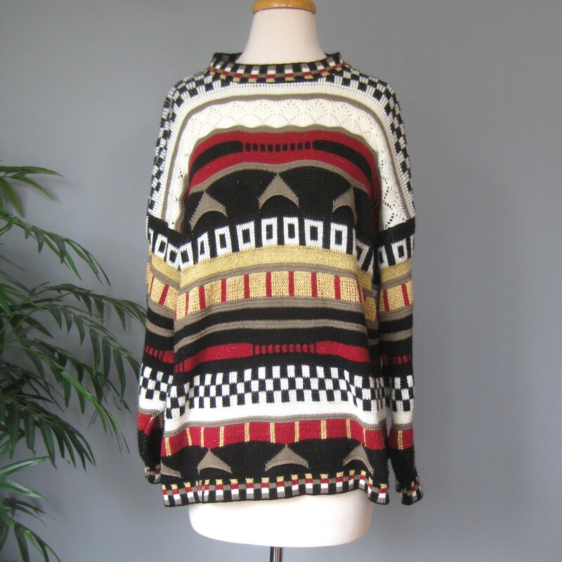 Cute sweater in tones of black, white, brown, red, black and gold.<br />
Bold stripes each with a different p atter.<br />
Crew Neck<br />
Size Large<br />
100% Acrylic<br />
By Trimmings<br />
Armpit -Armpit: 23<br />
Sleeve: 18<br />
Width at Hem: 24<br />
L: 27.5<br />
Great vintage condition.<br />
<br />
Thanks for looking!<br />
#79240