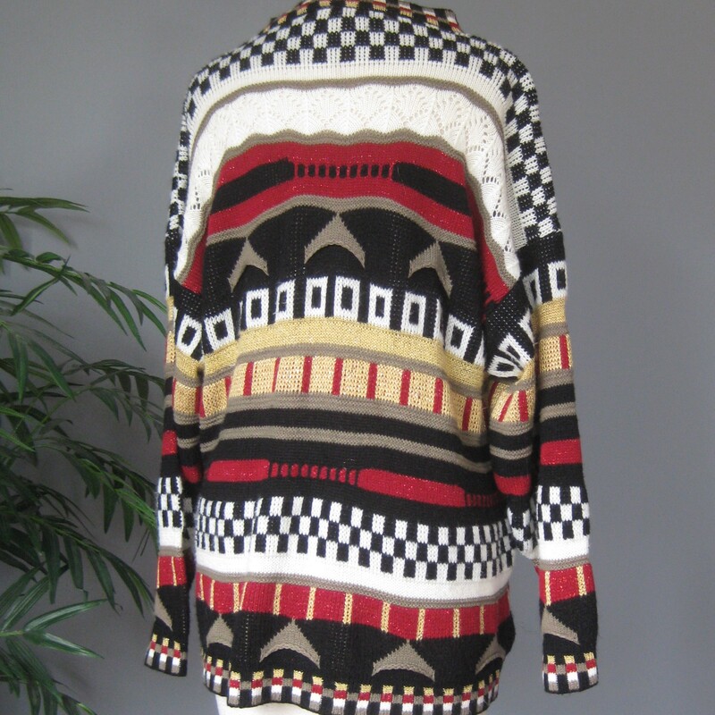 Cute sweater in tones of black, white, brown, red, black and gold.
Bold stripes each with a different p atter.
Crew Neck
Size Large
100% Acrylic
By Trimmings
Armpit -Armpit: 23
Sleeve: 18
Width at Hem: 24
L: 27.5
Great vintage condition.

Thanks for looking!
#79240