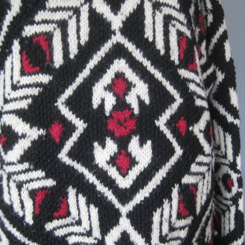 Wool hand knitted sweater from Jones NY<br />
Wintery black, red and white ski style pattern.<br />
Turtle or mock turtle neck<br />
It has 2 silver metal buttons at the bottom of each side seam that can be opened for a little more room at the hem.<br />
Marked size medium, might fit a modern size large as well.<br />
flat measurements:<br />
Shoulder to shoulder: 22<br />
armpit to armpit: 21.5<br />
width at hem: 22<br />
underarm sleeve seam: 19.5<br />
length: 27<br />
thanks for looking!<br />
#79144