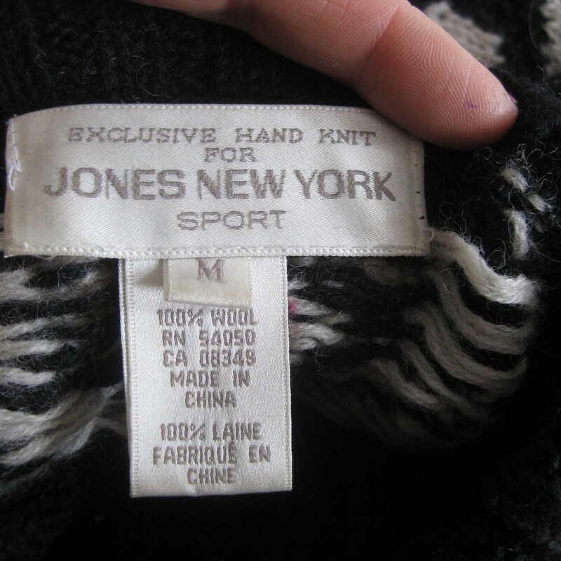 Wool hand knitted sweater from Jones NY<br />
Wintery black, red and white ski style pattern.<br />
Turtle or mock turtle neck<br />
It has 2 silver metal buttons at the bottom of each side seam that can be opened for a little more room at the hem.<br />
Marked size medium, might fit a modern size large as well.<br />
flat measurements:<br />
Shoulder to shoulder: 22<br />
armpit to armpit: 21.5<br />
width at hem: 22<br />
underarm sleeve seam: 19.5<br />
length: 27<br />
thanks for looking!<br />
#79144