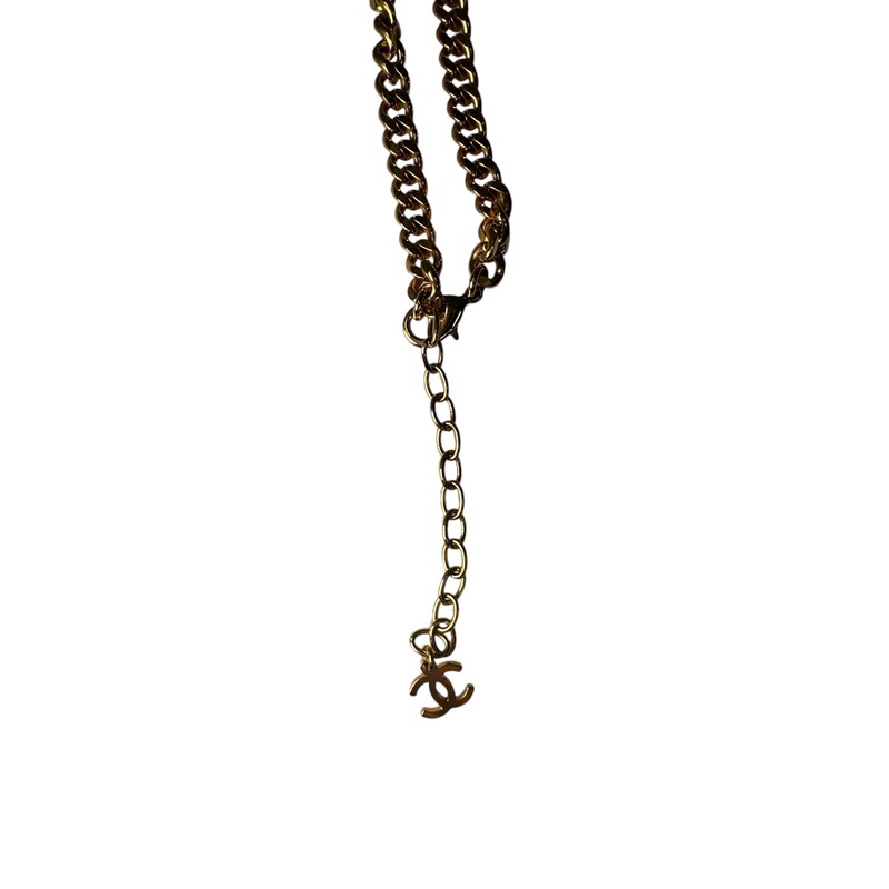 CHANEL Metal Pearl CC Chain Pendant Necklace in Gold. This elegant piece is a gold chain with a hanging CC logo pendant with faux pearls and gold resin beads.<br />
2020 Winter Collection<br />
Comes with box and dust bag