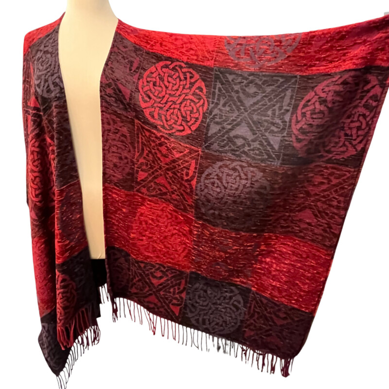 New Calzeat Celtic Ruana<br />
New With Tags<br />
Woven Celctic Design<br />
Wool Blend with Fringe Detail<br />
Designed and Woven in Scotland<br />
Colors:  Red and Plum<br />
Retails for $161.00